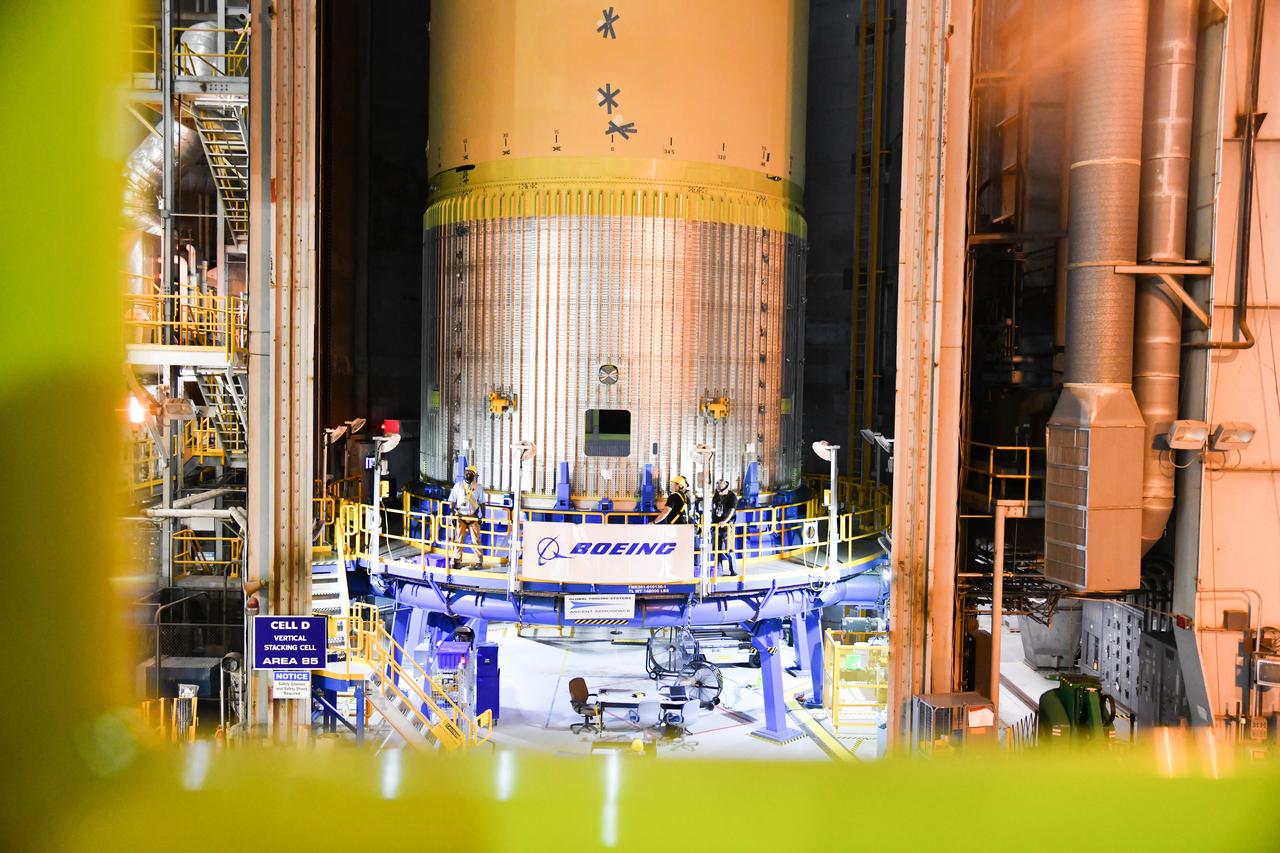The Space Launch System (SLS) rocket’s liquid oxygen tank structural test article was manufactured and stacked in June 2019 at NASA’s Michoud Assembly Facility in New Orleans. To construct the test article, Boeing technicians at Michoud moved the liquid oxygen tank to the Vertical Assemby Building stacking and integration area. Here, they added simulators to mimic the two structures that connect to the tank, the intertank and the forward skirt.  This structural hardware for the SLS core stage for America’s new deep space rocket is structurally identical to the flight version of the tank. It will be shipped on the Pegasus barge to NASA’s Marshall Space Flight Center in Hunstville, Alabama, where it will undergo a series of tests that simulate the stresses and loads of liftoff and flight. These tests will help ensure designs are adequate for successful SLS missions to the Moon and beyond. The flight liquid oxygen tank along with the liquid hydrogen tank supplies more than 500,000 gallons of propellant to the core stages four RS-25 engines, which produce 2 million pounds of thrust to help send the SLS rocket to space.